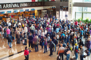 Travelers arrive at the immigration checkpoint at Changi Airport in Singapore
