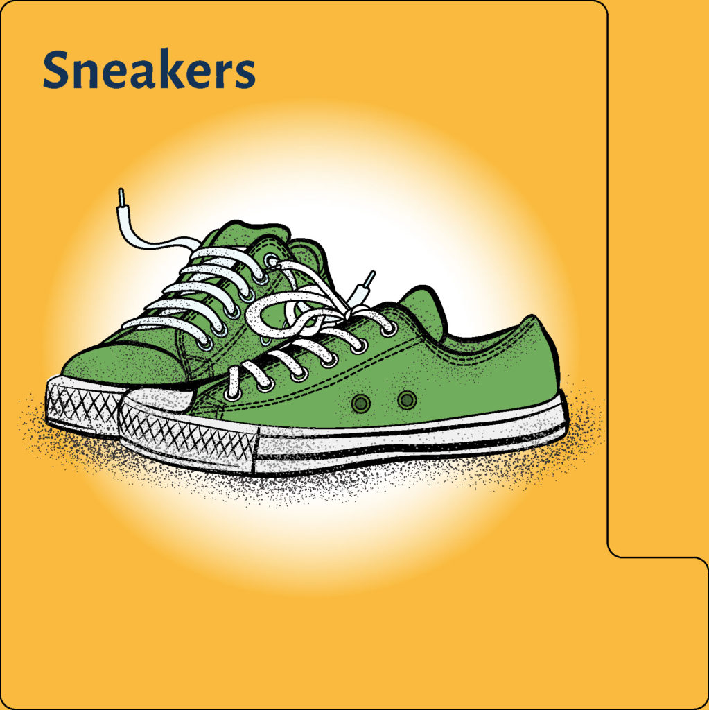 green athletic shoes with white laces on yellow background